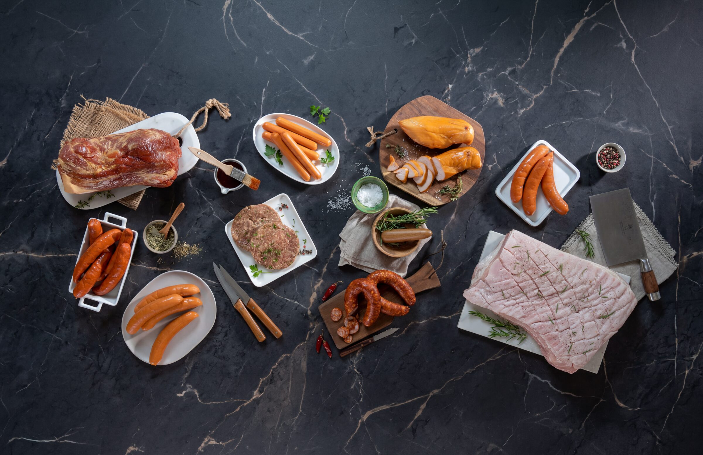 A spread of premium Meat Mania sausages, smoked meats and charcuterie