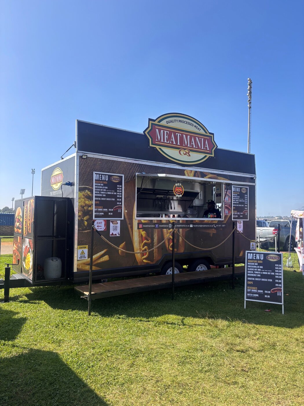 The Meat Mania food truck serving at an event